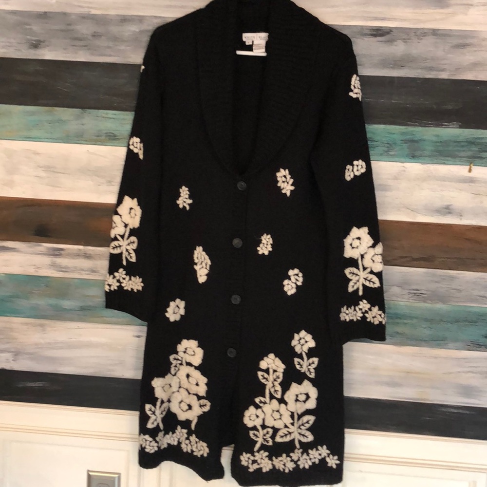 Knee length embroidered button up sweater.